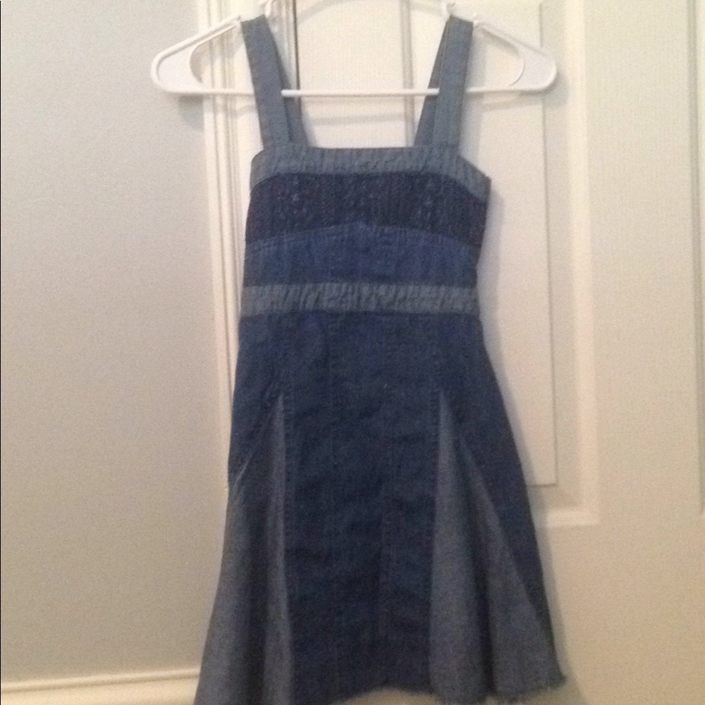 Dress is size small and is made of Jean material.
